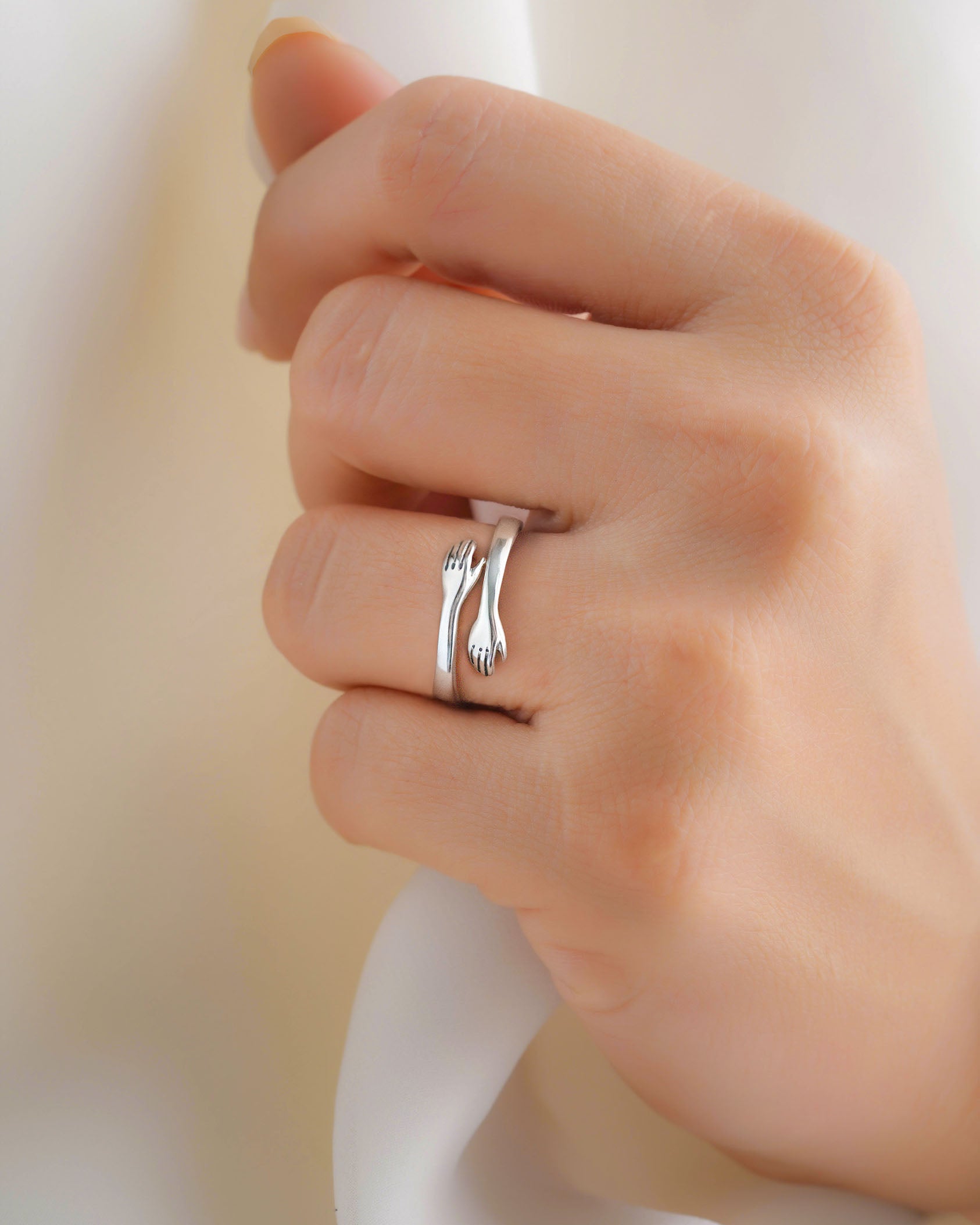 Embrace Your Love: The Sterling Silver Hug Ring